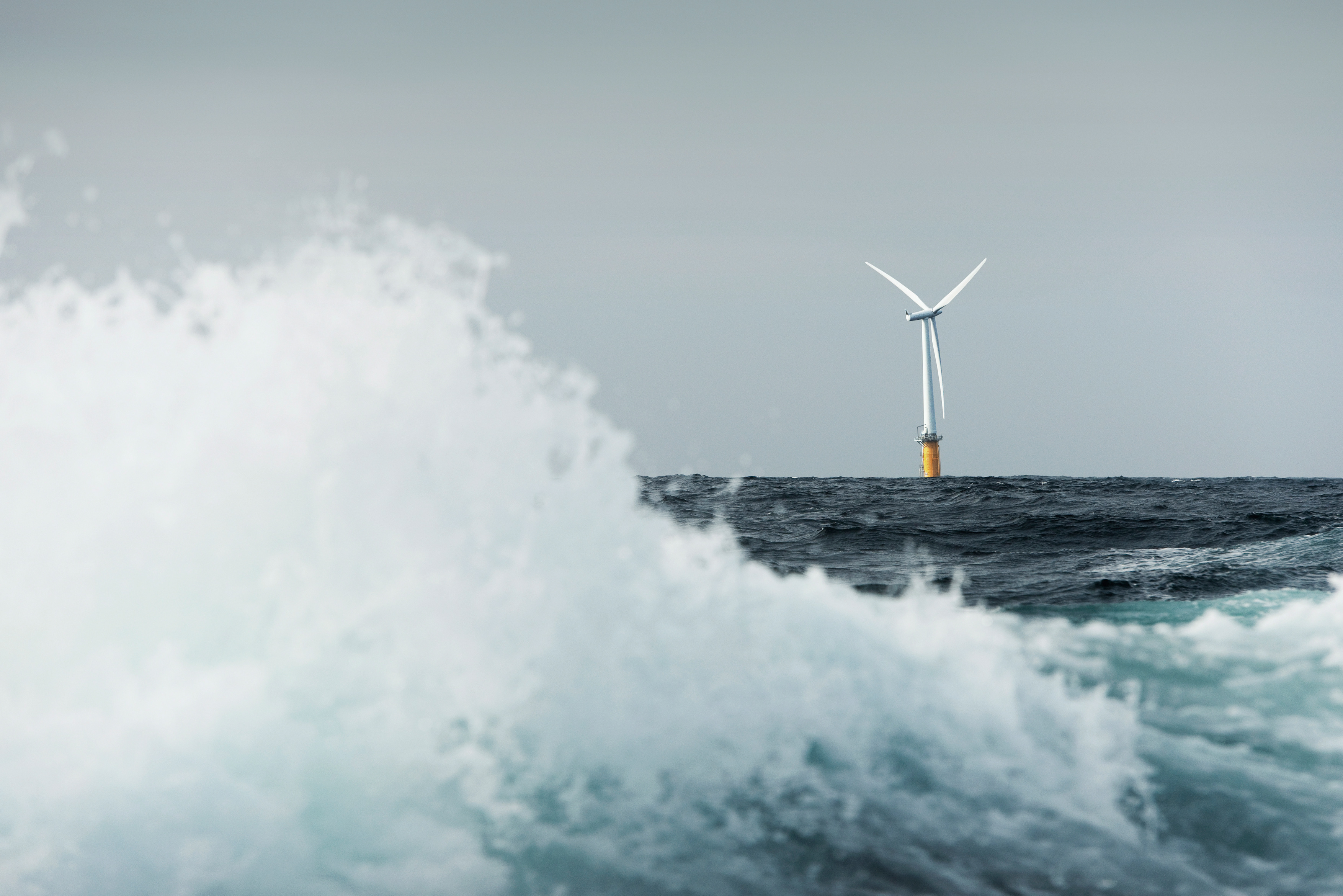 Floating offshore wind turbine on the horizon with large wave in the foreground-© Equinor-2